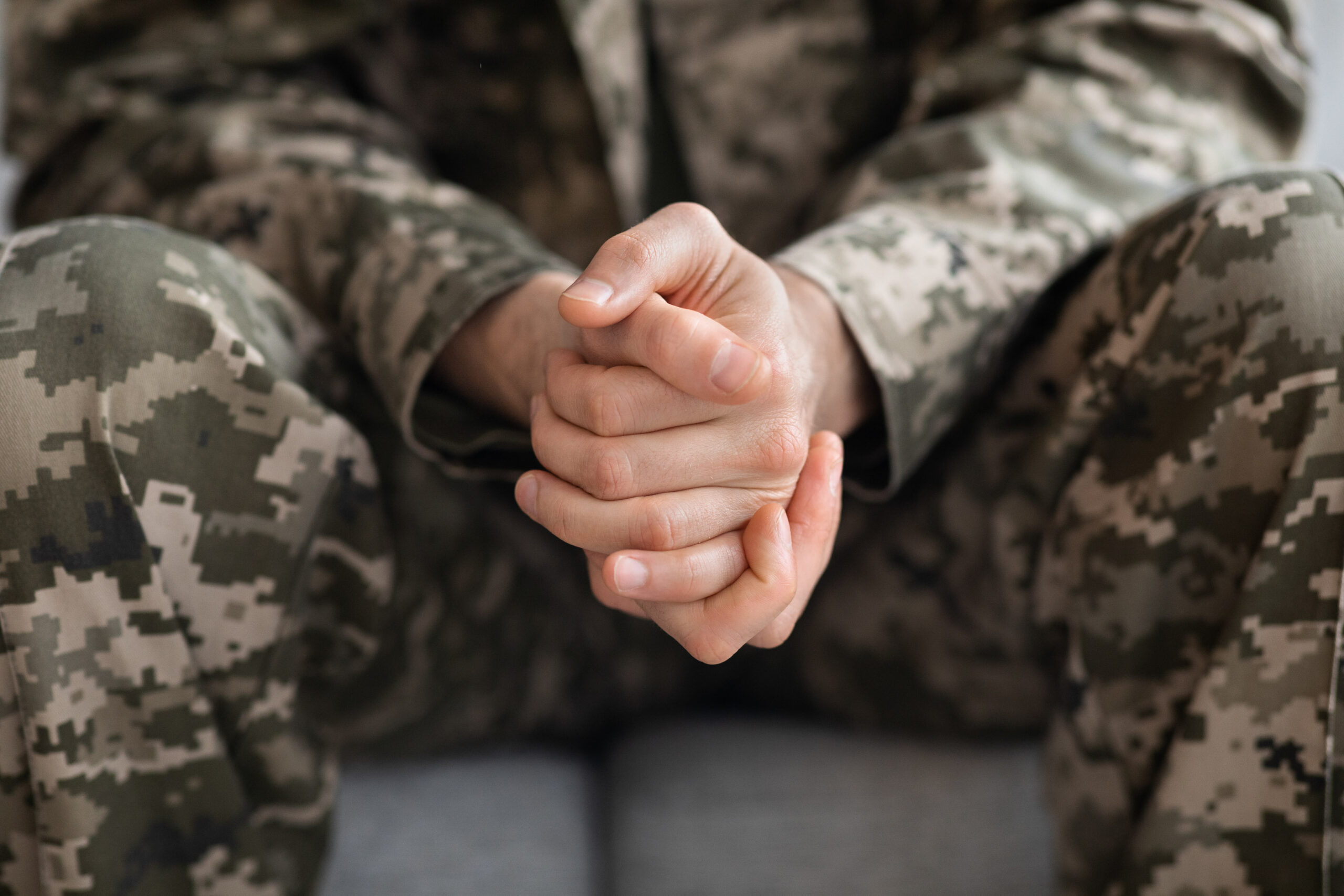 Solider Holding Hands Clasped
